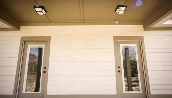 We offer siding services in Charles Town, West Virginia. Hardie plank siding installation in a front entry way.